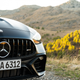 2023 mercedes-amg c 63 s e-performance in matte black photographed on the side of a mountain road in spain